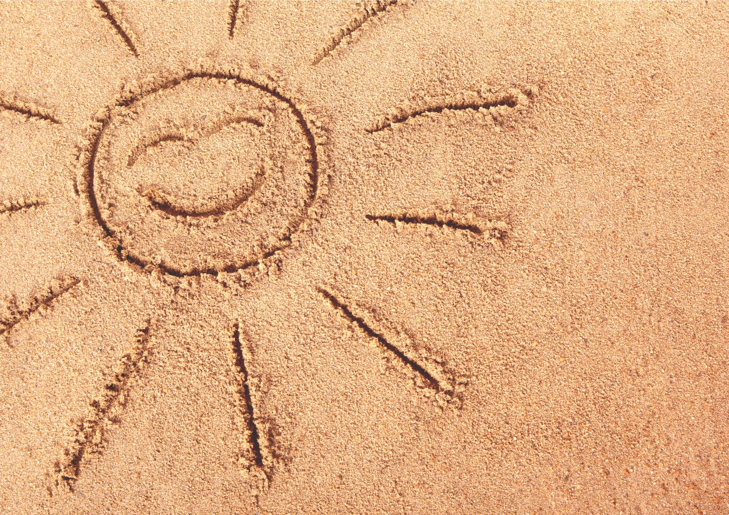 soleil dessiné sur le sable vitamine D